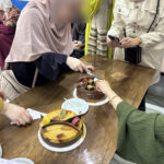 Elite d'Or English teacher Roumaissa cutting her birthday cake during her celebration party at the academy (2)