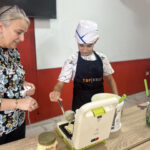 Elite d'Or French teacher and student holding homemade pancake after a fun cooking vocabulary lesson Dellys Algeria (2)