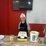 Elite d'Or children French class student preparing their own pancake during a hands-on cooking vocabulary lesson Dellys Algeria (2)