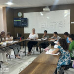 Elite d'Or children French language teacher posing and smiling with her young students Dellys Algeria (2)