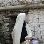 Elite-d'Or-student-trying-on-traditional-Haik-dress-representing-the-ancient-cultural-heritage-of-Dellys-Algeria