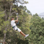 Elite-d'Or-students-having-fun-on-the-tyrolean-zip-line-during-the-Kfrida-adventure-trip-Algeria