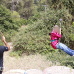 Elite-d'Or-students-having-fun-on-the-tyrolean-zip-line-during-the-Kfrida-adventure-trip-Algeria