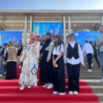 Elite d'Or students posing on the red carpet at the entrance of the International Book Fair Algiers Algeria