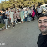 Nadjib from Elite d'Or selfie with students parents and staff during the Tipaza cultural trip Algeria