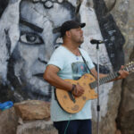 Street-musician-playing-guitar-captured-during-Elite-dOr-cultural-trip-to-Bejaia-Algeria
